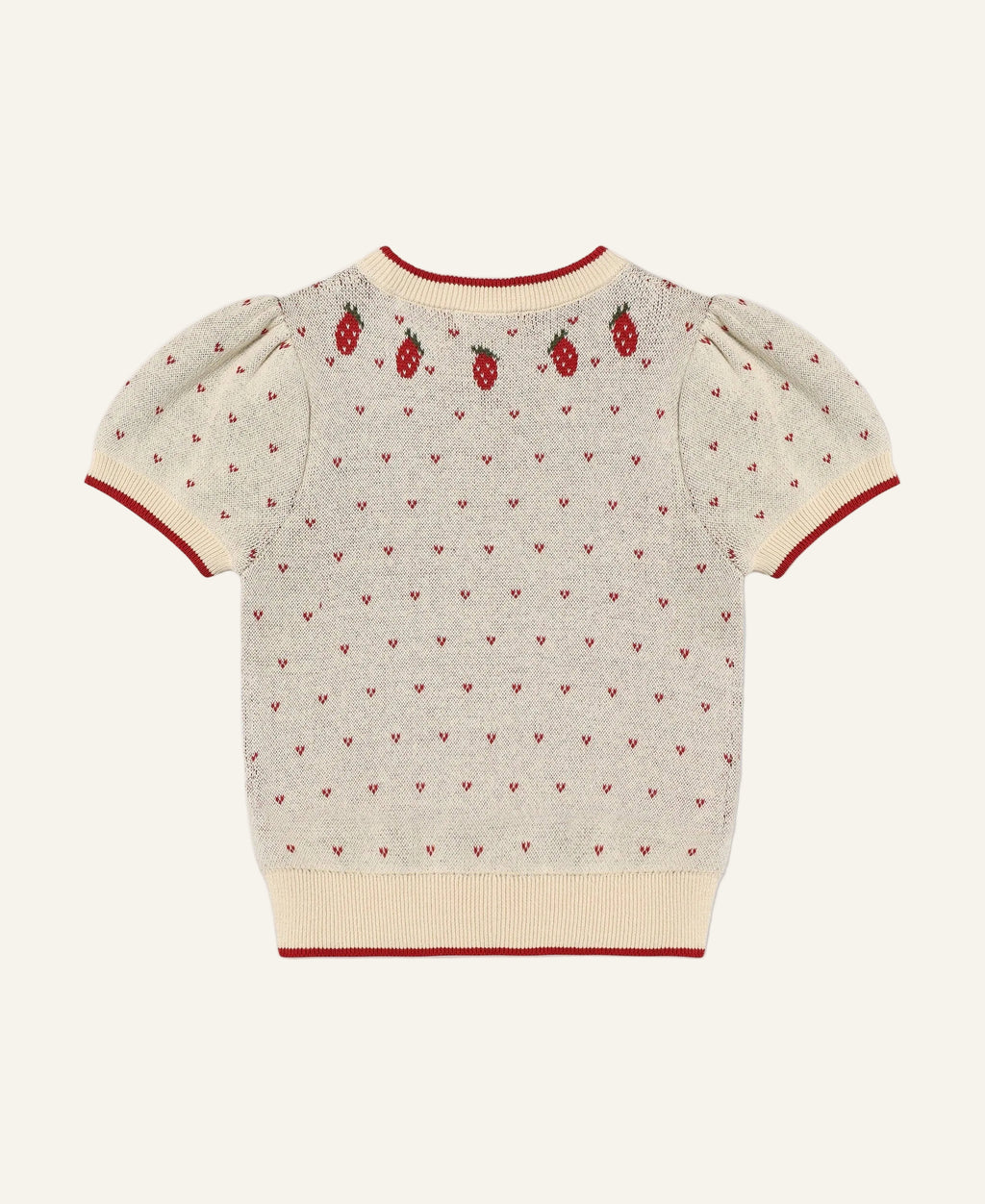 A cream-colored short-sleeve knit sweater with red trim, featuring a pattern of tiny red hearts and three embroidered red strawberries on the upper back, shown against a light gray background.