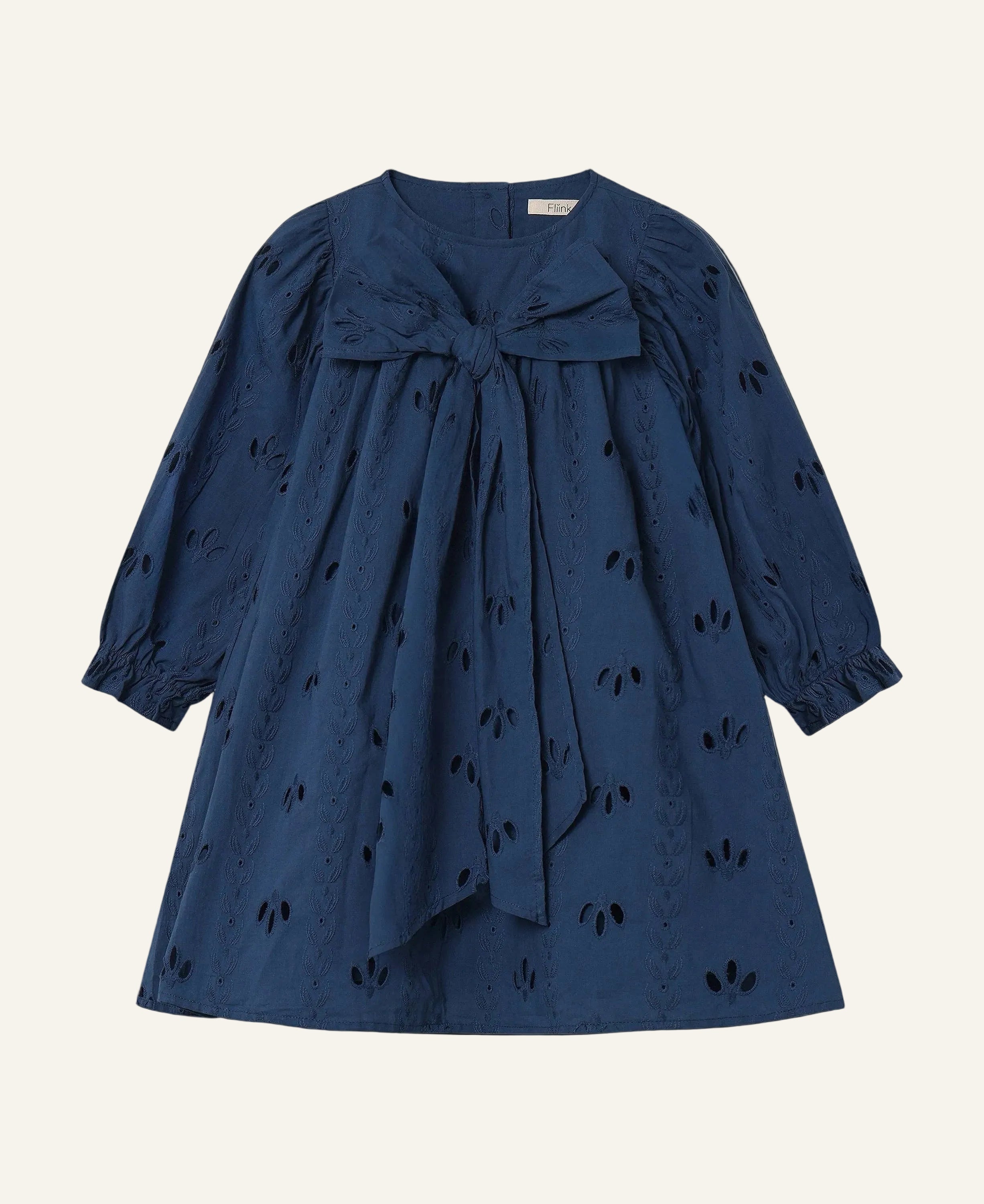 Blue dress with a bow detail on a light gray background