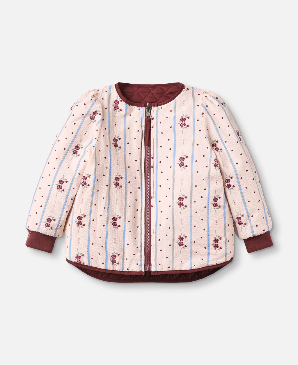 A children's quilted jacket with a light pink and white striped pattern, decorated with small red floral motifs and tiny red dots. It features solid dark red cuffs, hem, and collar, and a matching dark red zipper.