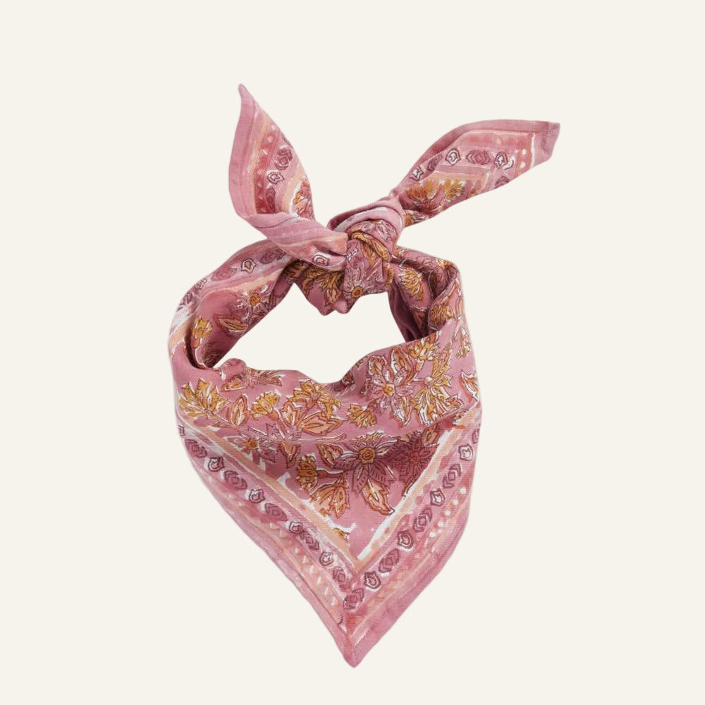 Pink floral patterned bandana on a white background
