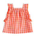 Orange and white checkered dress with ruffled straps on a white background