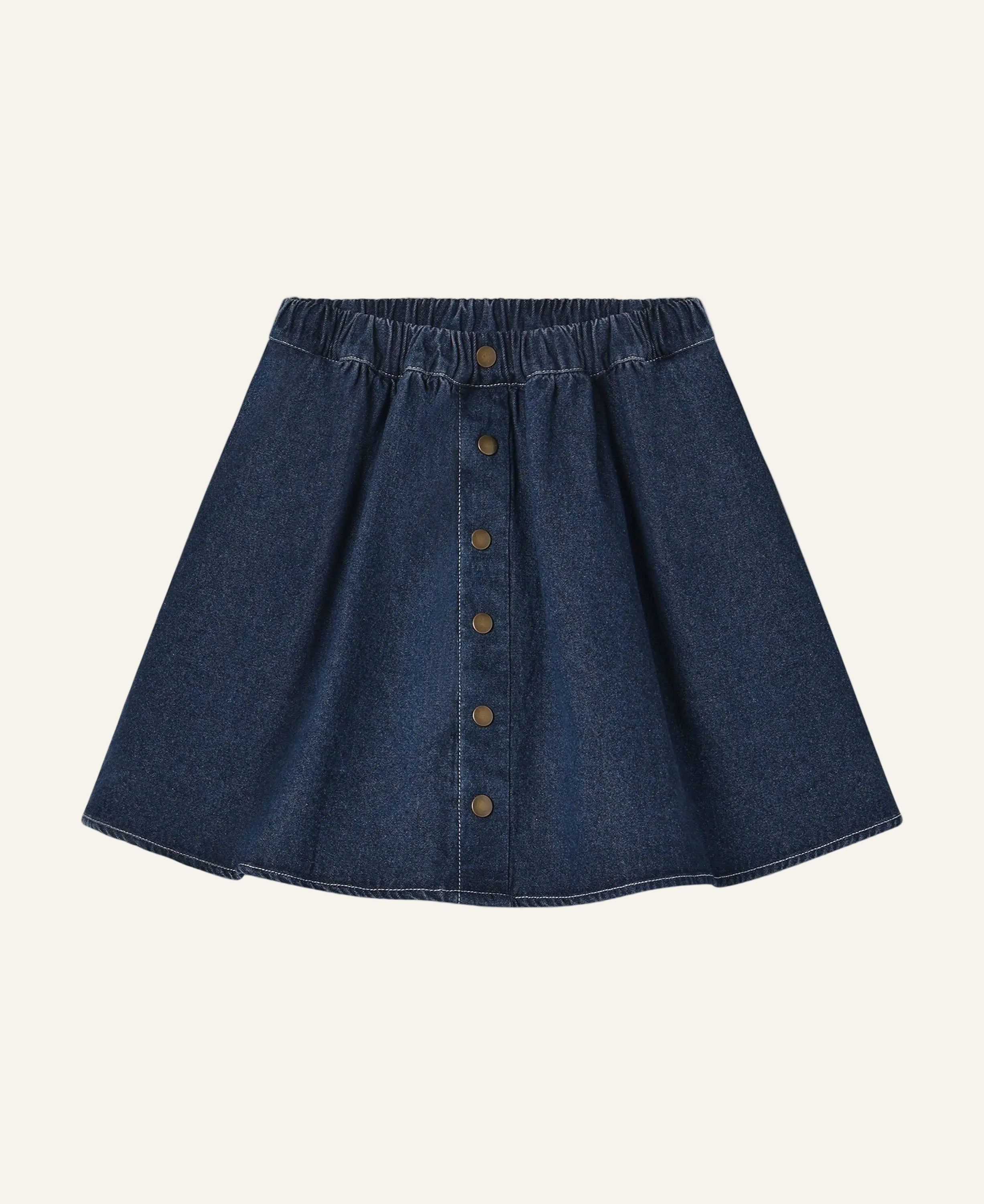 A dark blue denim A-line mini skirt with an elastic waistband and a front button closure, shown flat on a light gray background.