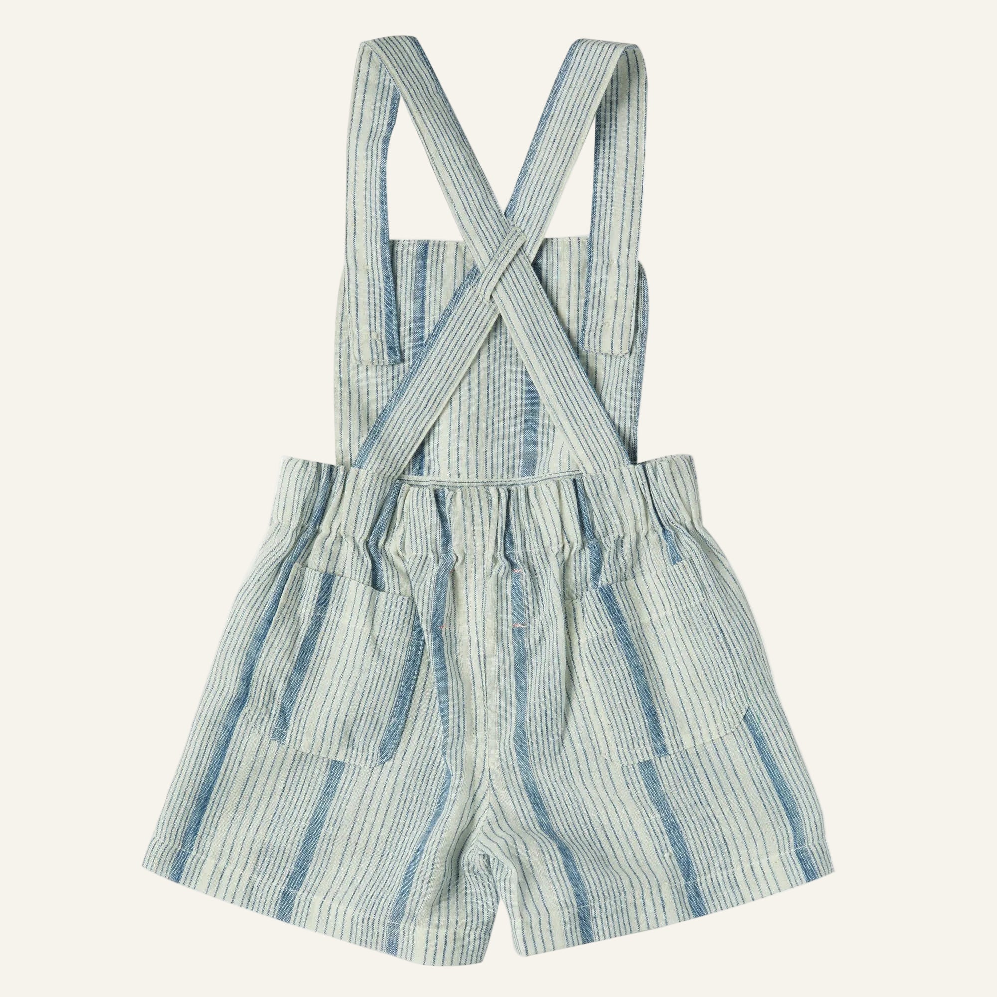 Striped romper with suspenders on a white background