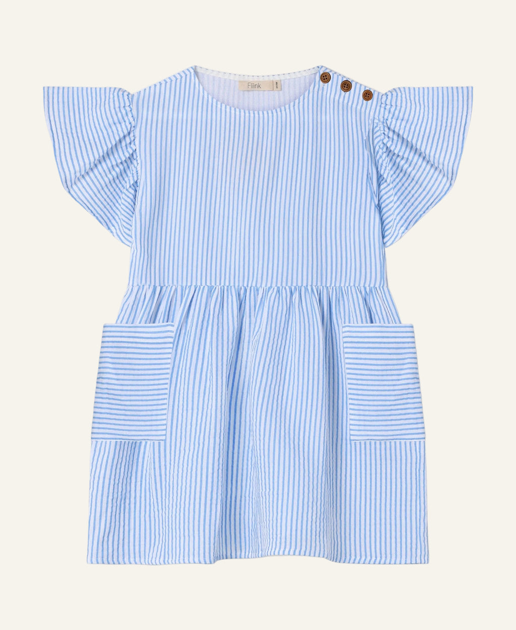 A light blue and white vertically striped baby dress with flutter sleeves, a round neckline, and two brown button details on the shoulder. It features a gathered waist and two large patch pockets on the front, shown against a plain light gray background.