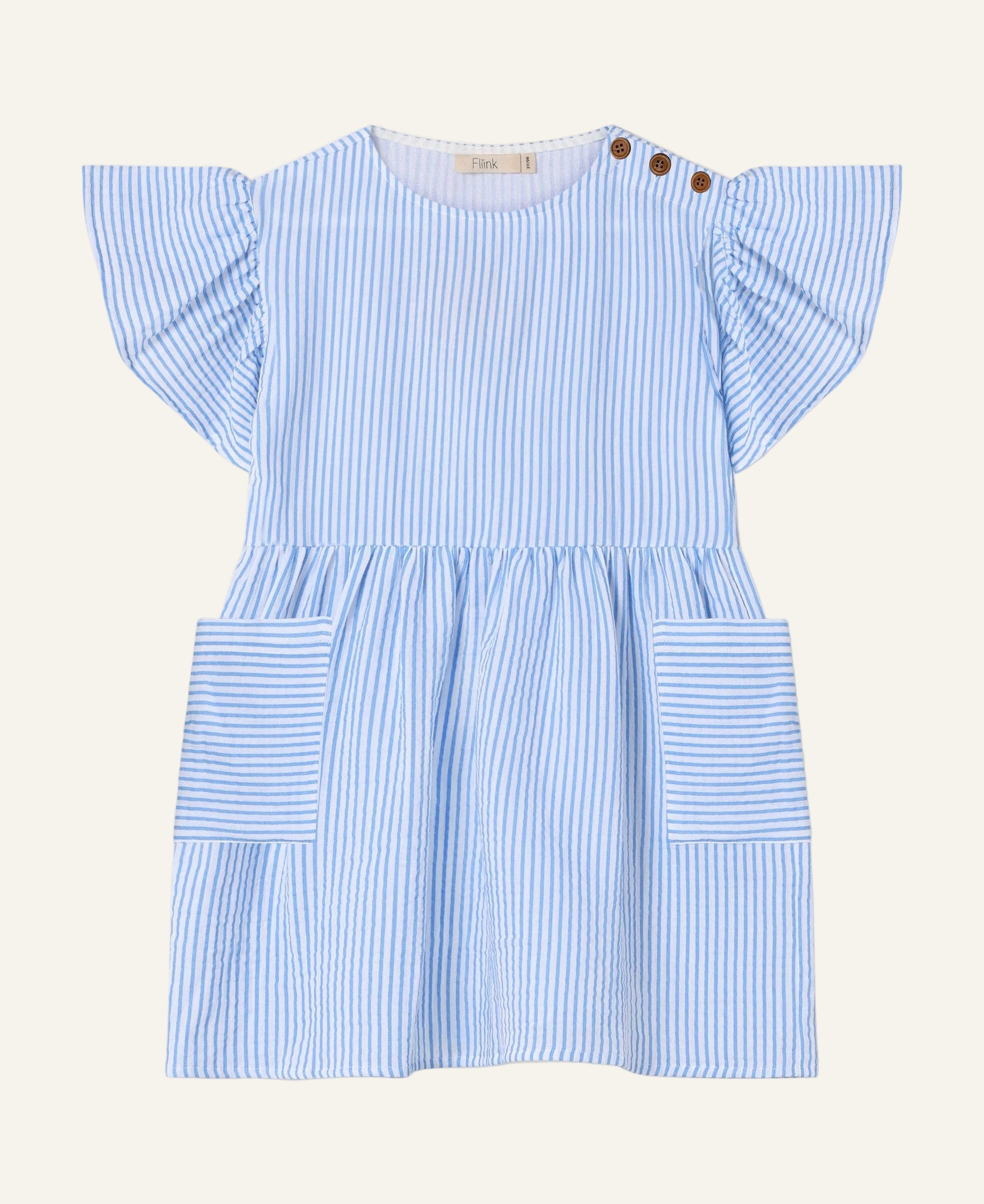 A light blue and white vertically striped baby dress with flutter sleeves, a round neckline, and two brown button details on the shoulder. It features a gathered waist and two large patch pockets on the front, shown against a plain light gray background.