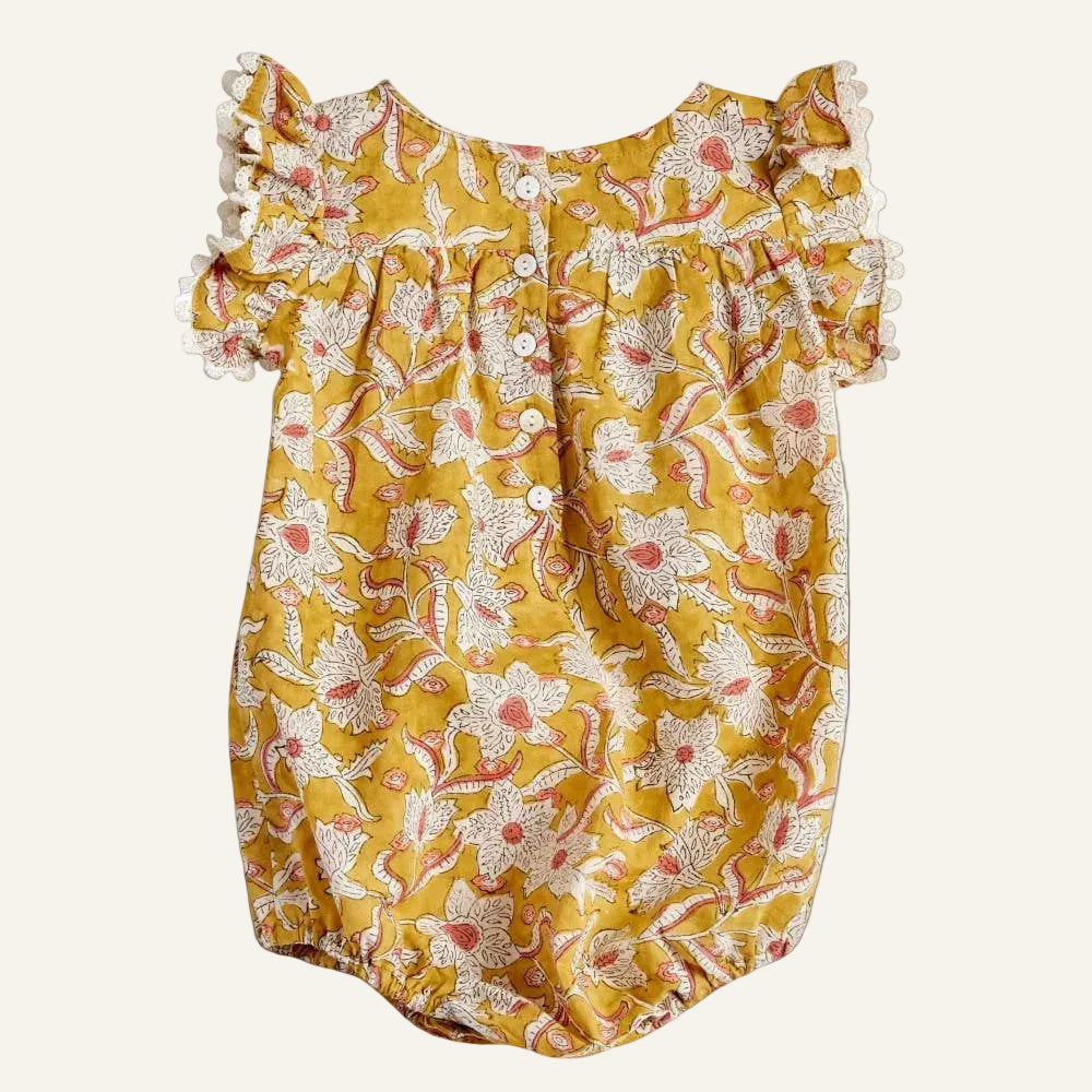 Yellow floral dress with ruffled sleeves on a white background