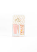 A nail kit by Ertha containing a soft pink nail polish bottle and a clear compartment filled with pastel pink, yellow, and orange glitter flakes, set against a plain white background.