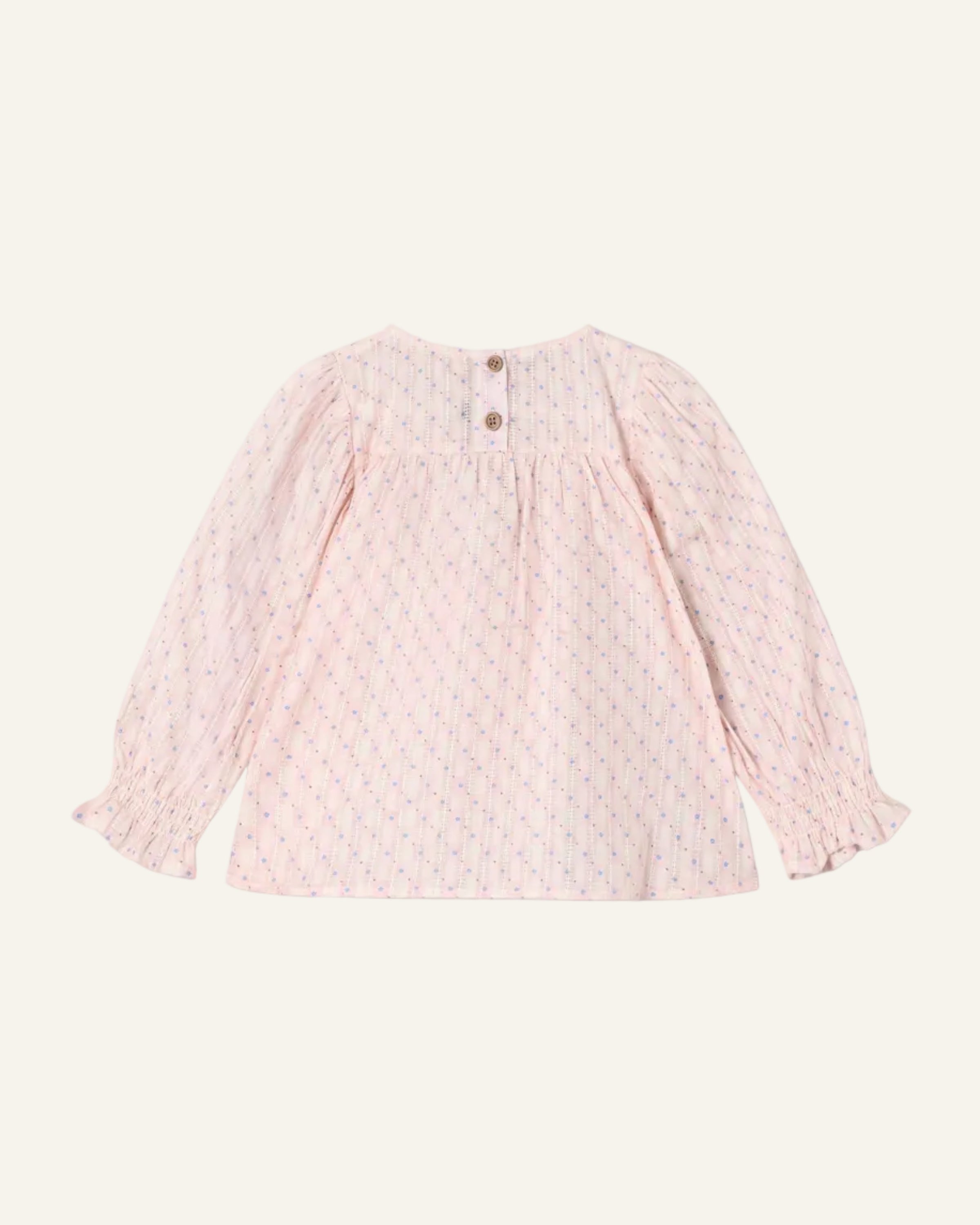 Pink textured long-sleeve top on a light gray background