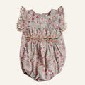Floral baby romper with ruffled sleeves on a white background