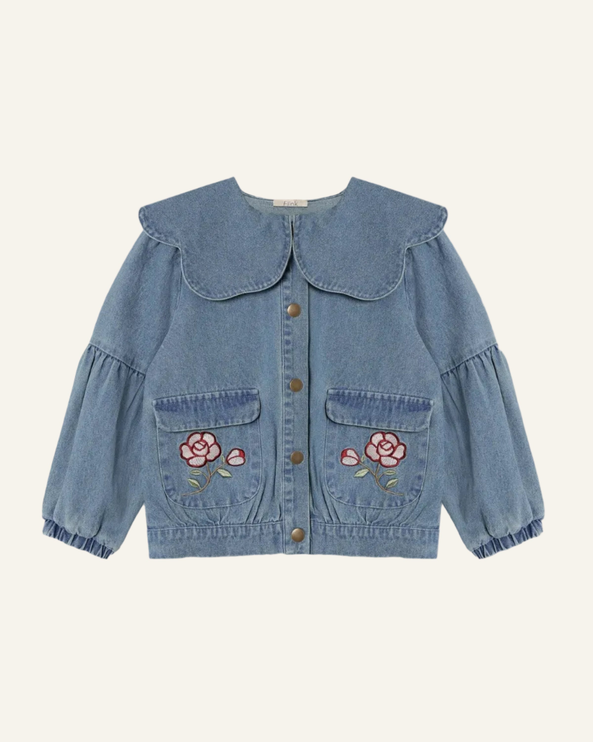 A light blue denim jacket for children, featuring a large Peter Pan collar, button-front closure, ruffled cuffs, and embroidered pink roses on the front pockets.
