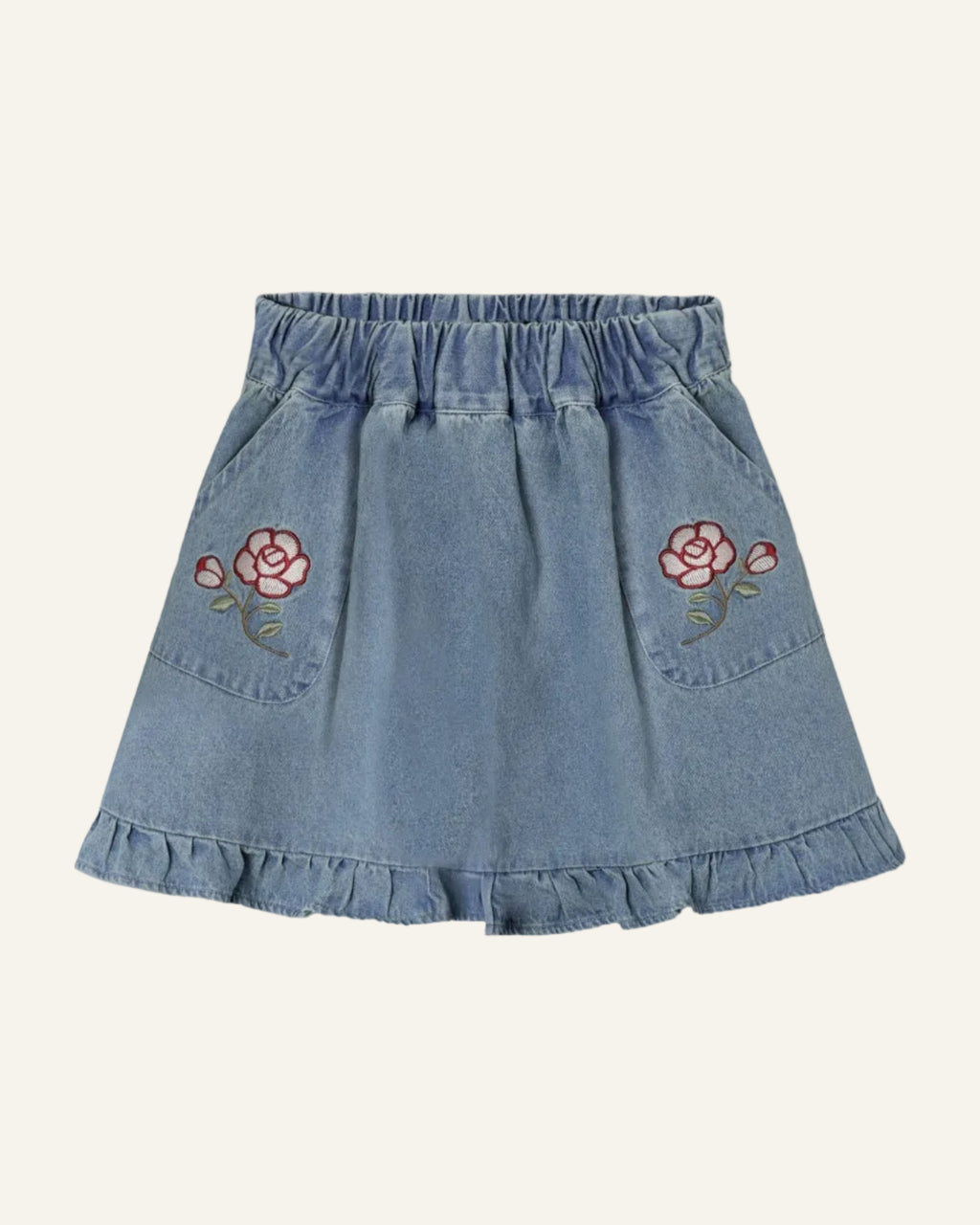 Denim skirt with floral embroidery on a light gray background