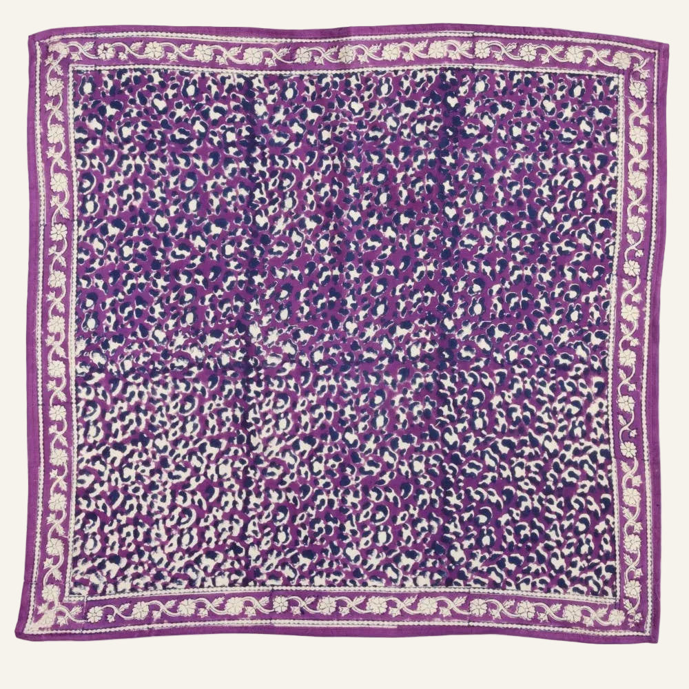 Purple fabric with white pattern on a white background