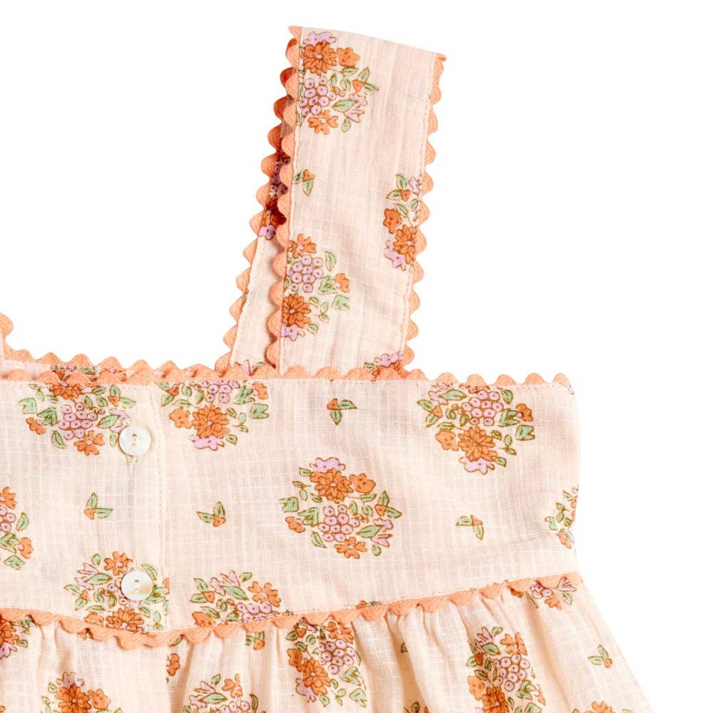Floral dress with ruffled details on a white background