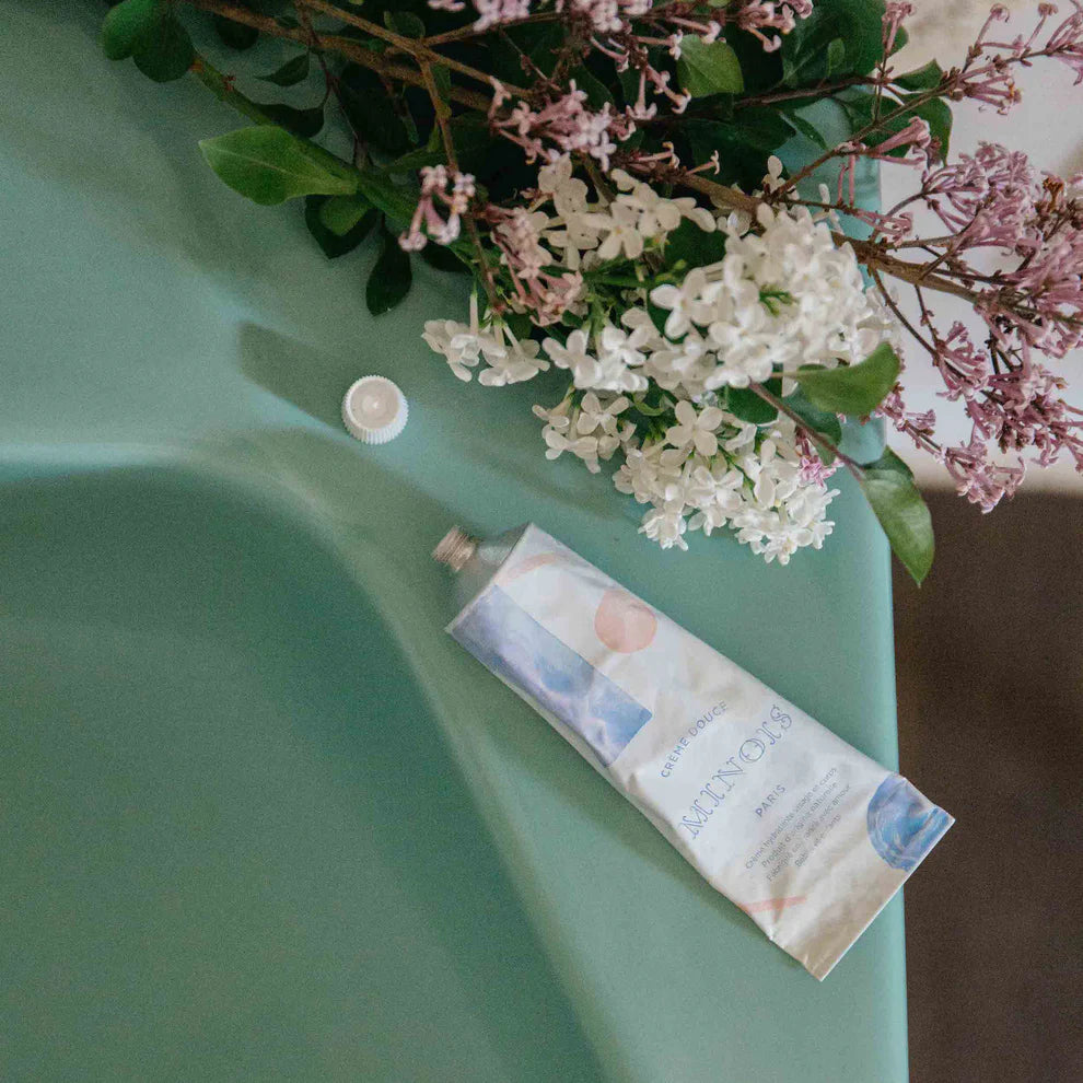 Product packaging with flowers on a green surface