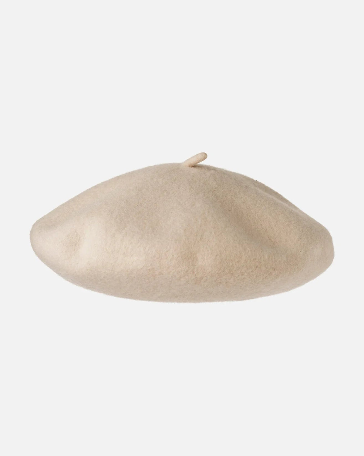 A classic felt beret hat in a light cream or beige color, photographed against a solid light gray background.