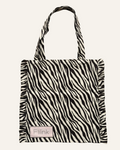 A black and white zebra print tote bag with fringed edges and double shoulder straps, featuring a small rectangular 'Flink' brand patch on the front, set against a plain white background.