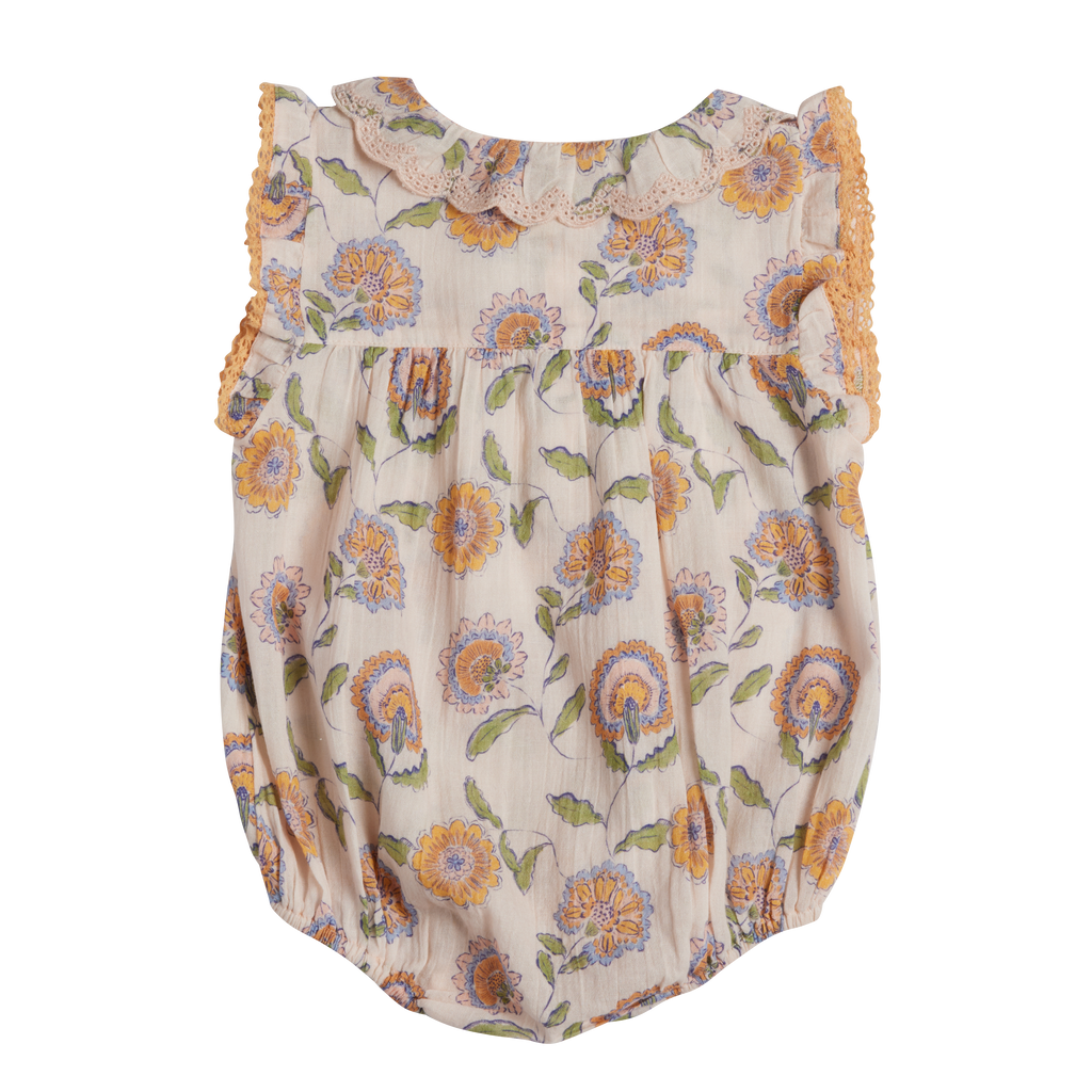 Floral baby romper with ruffled trim on a white background