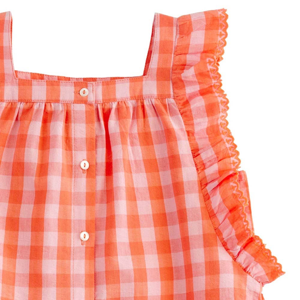 Orange and white checkered dress with ruffled trim on a white background
