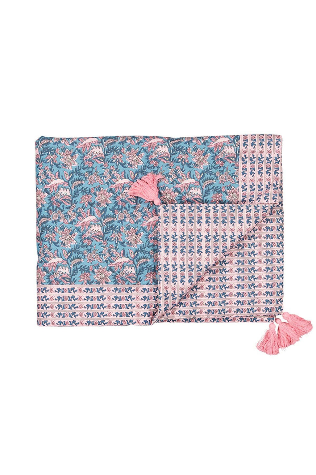 Floral patterned blanket with pink tassels on a white background