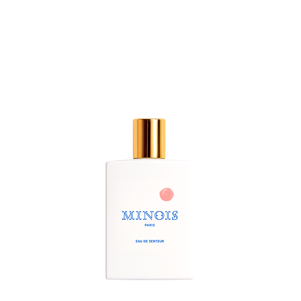 Perfume bottle with gold cap and white body on a white background