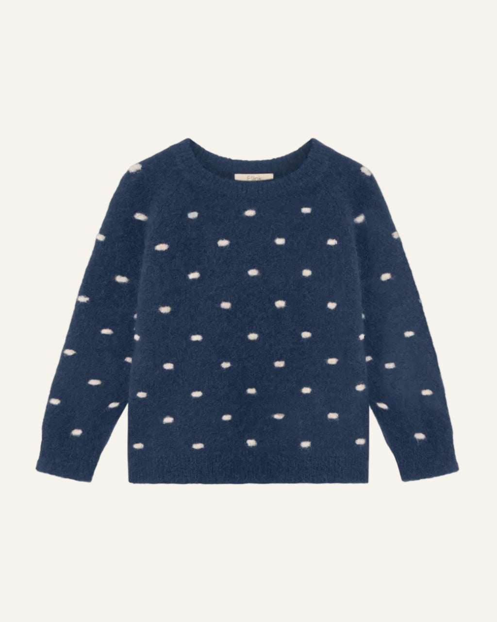 A navy blue knit sweater with a pattern of small, irregular cream-colored spots, displayed flat against a light gray background.