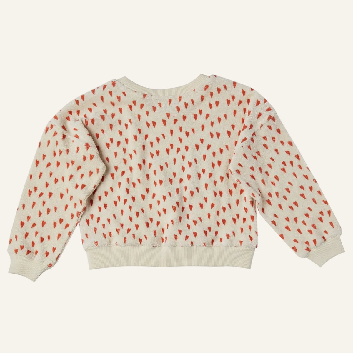 A cream-colored long-sleeve sweatshirt with a repeating pattern of small red hearts, shown from the back against a plain white background.