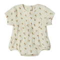 A short-sleeve baby romper in cream-colored cotton fabric with a small, all-over floral print, displayed flat against a white background.