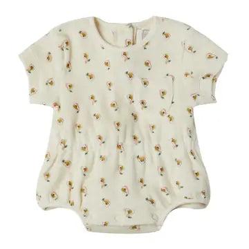A short-sleeve baby romper in cream-colored cotton fabric with a small, all-over floral print, displayed flat against a white background.