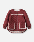 A quilted burgundy zip-up jacket with floral patterned trim on the pockets and chest, displayed flat against a light gray background.