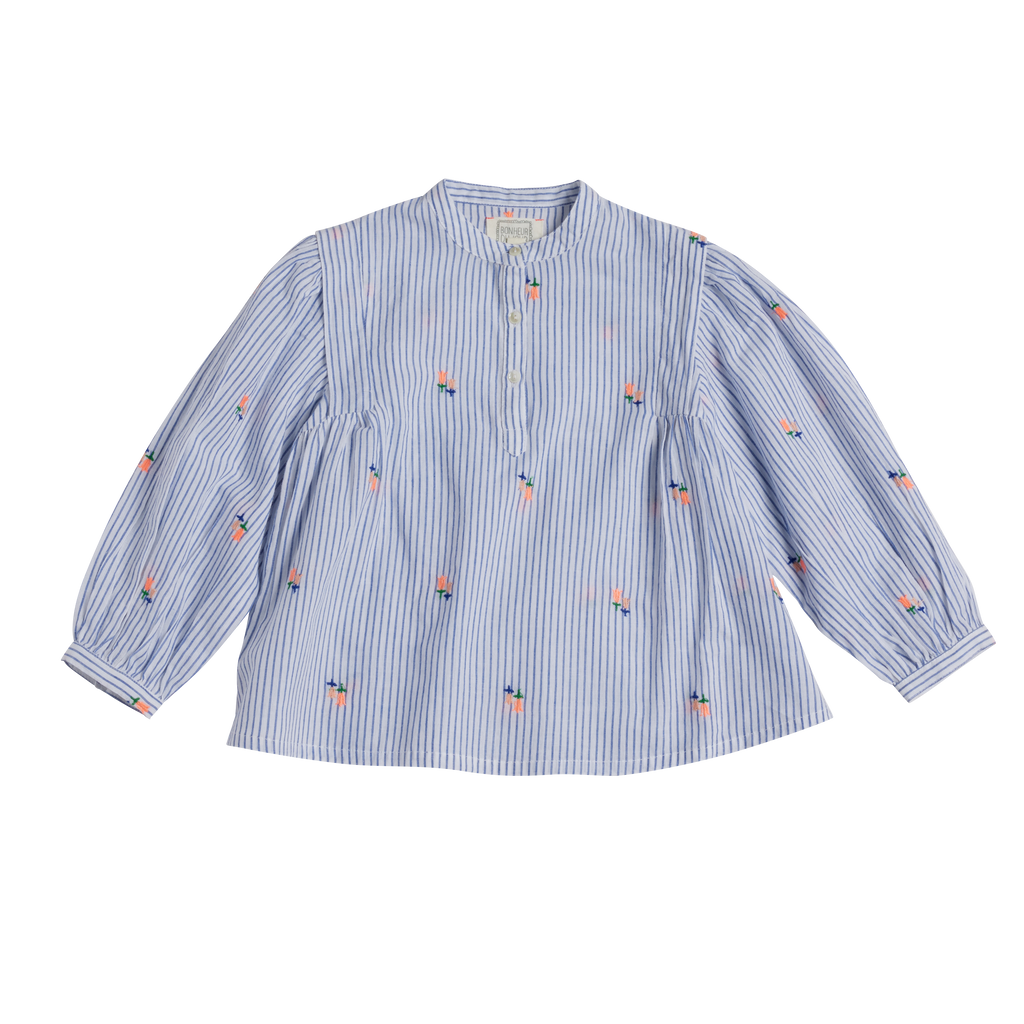 Blue and white striped shirt with small colorful patterns on a white background