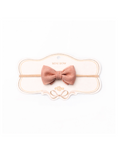Pink bow hair accessory on a white background