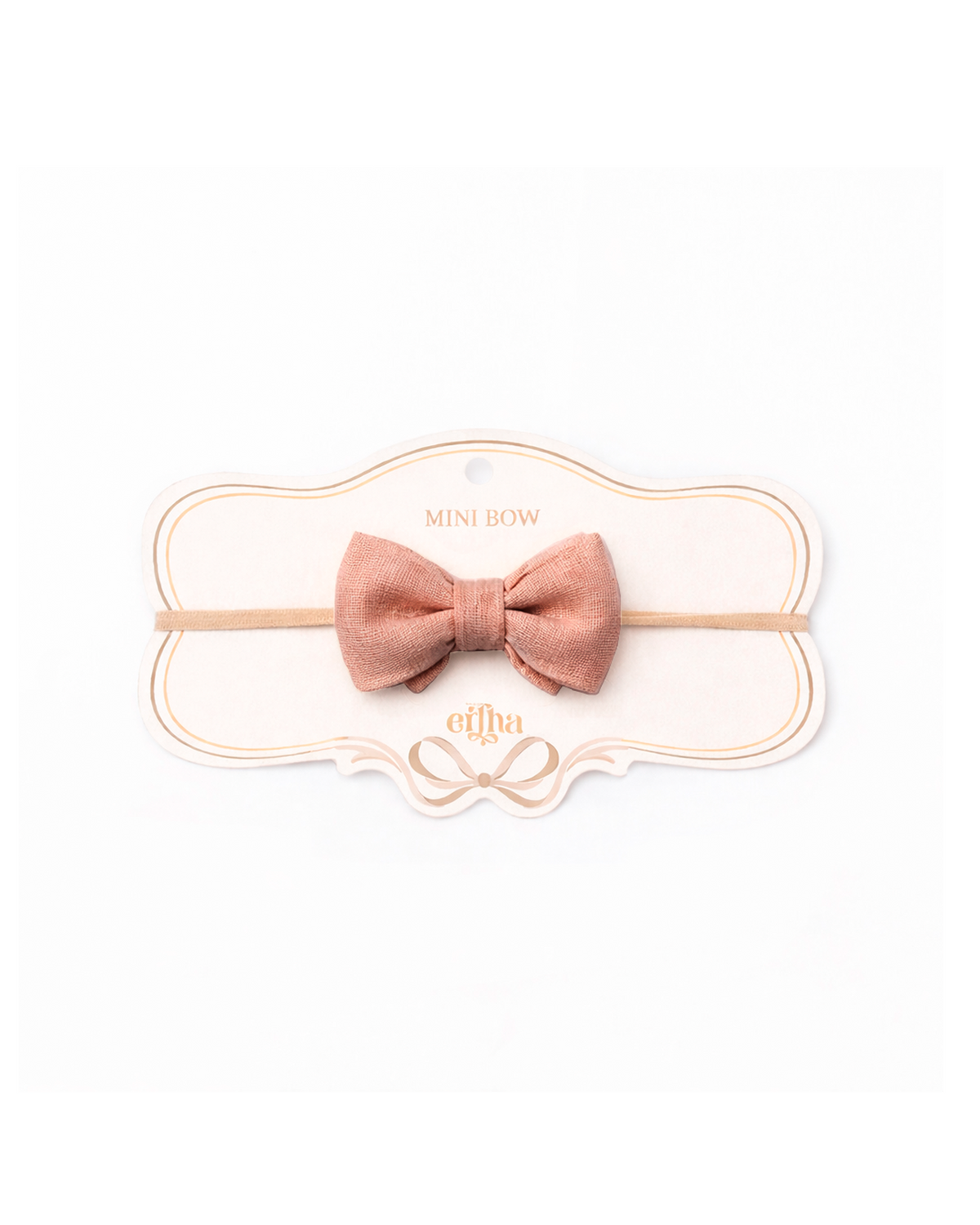 Pink bow hair accessory on a white background