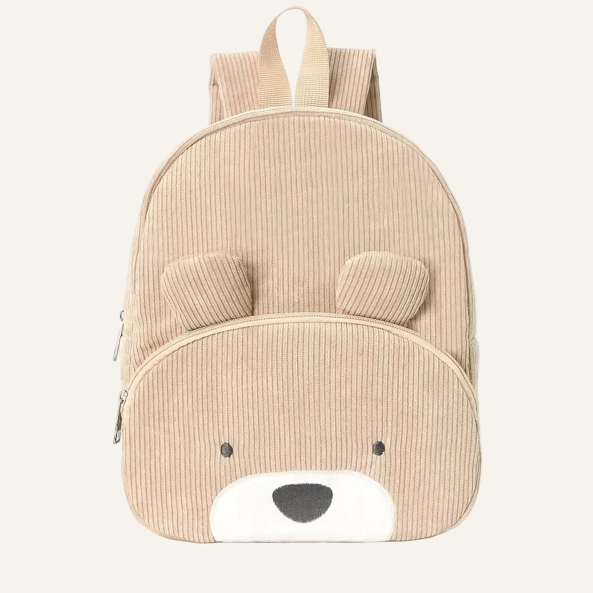 A beige corduroy children's backpack shaped like a bear face, featuring a front zippered pocket with embroidered eyes and nose, and padded shoulder straps, shown on a white background.