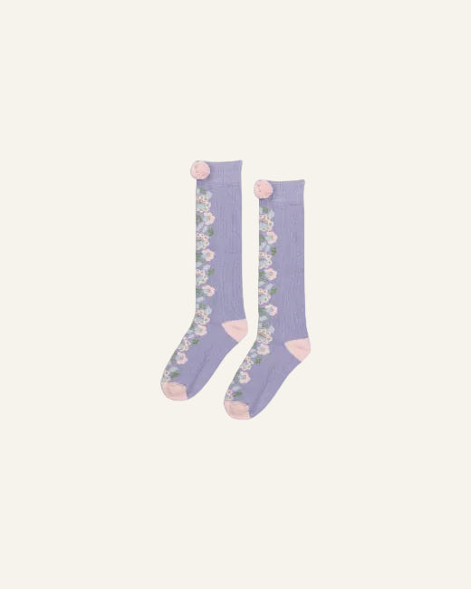 A pair of lavender purple knee-high socks with a floral pattern and light pink accents, displayed against a light gray background.
